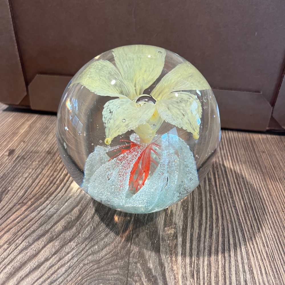 Glass paperweight yellow flower